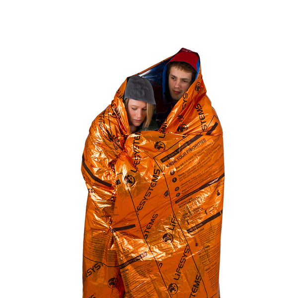 Lifesystems Heatshield double thermal blanket wrapped around two people