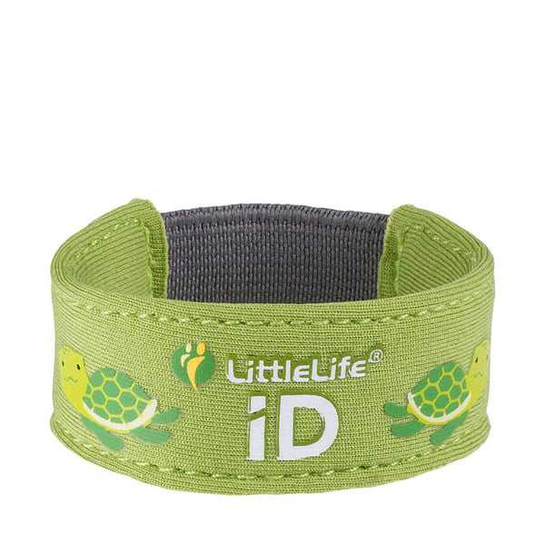 Studio shot on a white background of a Littlelife Identification wristband in the turtle pattern